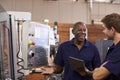 Engineer Training Male Apprentice On CNC Machine