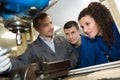 engineer training male apprentice on milling machine