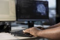 Engineer typing on keyboard, doing data center automation using AI Royalty Free Stock Photo