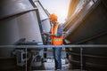 A engineer under checking the industry cooling tower air conditioner is water cooling tower air chiller HVAC of large industrial b Royalty Free Stock Photo