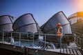 A engineer under checking the industry cooling tower air conditioner is water cooling tower air chiller HVAC of large industrial b Royalty Free Stock Photo