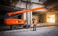 A engineer under inspection and checking construction process railway ,straight Boom Lift to construction roof on sky rail train b