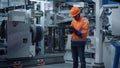 Engineer use tablet computer at industrial factory closeup. Supervisor concept.