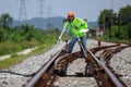 Engineer use theodolite equipment surveying construction worker on Railway site