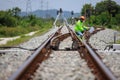 Engineer use theodolite equipment surveying construction worker on Railway site