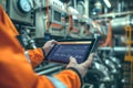An engineer uses a tablet to control smart factory automation software. Generative AI