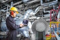 Engineer using computer for maintenance in thermal power plant Royalty Free Stock Photo