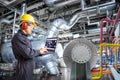 Engineer using computer for maintenance in thermal power plant Royalty Free Stock Photo