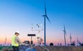 Engineer using laptop computer collect data with meteorological instrument to measure the wind speed, temperature and humidity and