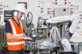 Engineer using laptop computer for maintenance automatic robotic