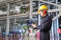 Engineer using laptop computer for maintenance at powerhouse Royalty Free Stock Photo