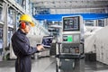 Engineer using laptop computer for maintenance in powerhouse Royalty Free Stock Photo