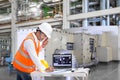 Engineer using laptop computer for maintenance in thermal power factory