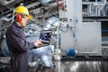 Engineer using laptop computer in thermal power plant factory Royalty Free Stock Photo