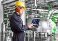 Engineer using laptop computer in thermal power plant factory Royalty Free Stock Photo