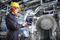 Engineer using laptop computer in thermal power plant factory Royalty Free Stock Photo