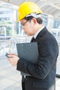 Engineer is using the mobile phone digital tablet Royalty Free Stock Photo