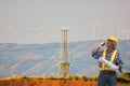 Electric engineer with wind turbine site Royalty Free Stock Photo