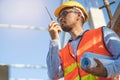 Engineer using radio to command to labour team in site construction Royalty Free Stock Photo