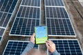 Engineer using solar system application. Checking solar panel setup. Royalty Free Stock Photo