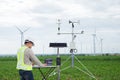 Engineer using tablet computer collect data with meteorological