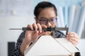 Engineer using Vernier caliper to measuring architectural model Royalty Free Stock Photo
