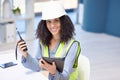 Engineer, walkie talkie and tablet with a black woman working in logistics, construction or engineering using technology Royalty Free Stock Photo
