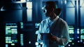 Engineer walking through server rows