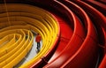 Engineer walks past yellow gas pipe and inspect the inside of large gas pipes