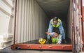 Engineer wear PPE urgently assisted the male technique inside container as Chemical spill in the container shipping industry