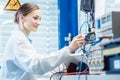 Engineer woman measuring electronic product on test bench Royalty Free Stock Photo