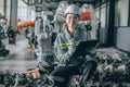 Engineer woman team worker work in Machine Robotic modern Automation Industry. Mechanic staff employee in metal factory