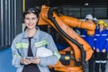 Engineer woman team worker work in Machine Robotic modern Automation Industry. Mechanic staff employee in metal factory