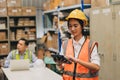 Engineer woman work in hardware products warehouse store using tablet parts inventory management software Royalty Free Stock Photo