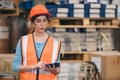 Engineer woman work in hardware products warehouse store using tablet parts inventory management software Royalty Free Stock Photo