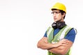 Engineer or worker in hardhat, safety vest, safety glasses in factory or site work. Engineer or professional contractor cross arm