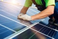 Engineer worker man employee technician inspects solar panels batteries. Advanced technological install panels green