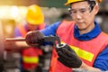 Engineer worker using Vernier Caliper to check gear size for accuracy precision quality control of service part in factory