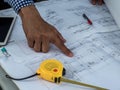 Engineer and workers discussing project of new building. architects Asian people on construction site check documents and business Royalty Free Stock Photo