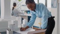 Engineer working on blueprints plans on desk to design building model and maquette Royalty Free Stock Photo