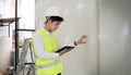 Engineer working on building site with digital tablet Royalty Free Stock Photo