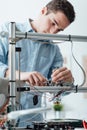 Engineer working on a 3D printer Royalty Free Stock Photo