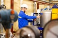 Engineer working inside oil and gas refinery Royalty Free Stock Photo