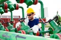 Engineer, working with pipeline controls inside oil and gas refinery Royalty Free Stock Photo