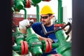 Engineer, working with pipeline controls inside oil and gas refinery Royalty Free Stock Photo