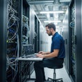 Engineer working on server rack infrastructure in data center Royalty Free Stock Photo