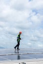 Engineer working setup Solar panel at the roof top. Engineer or worker work on solar panels or solar cells on the roof of business Royalty Free Stock Photo