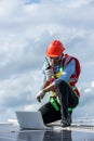 Engineer working setup Solar panel at the roof top. Engineer or worker work on solar panels or solar cells on the roof of business