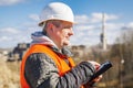 Engineer working with tablet PC near factory Royalty Free Stock Photo