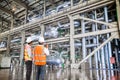 Engineer working in a thermal power plant with talking on radio Royalty Free Stock Photo